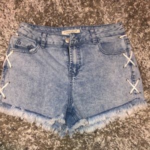 Jean shorts with lace on side